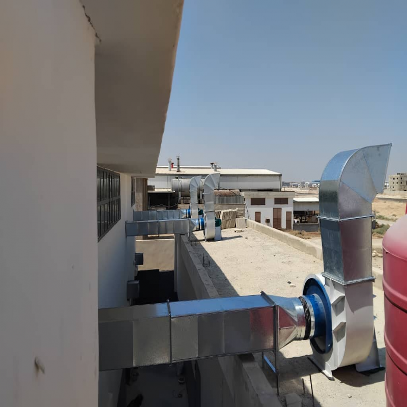 Outdoor Industrial Air Ducts and Exhaust Outlets on Facility Rooftop